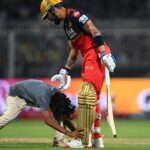 "18-Year-Old Fan Runs Onto Eden Gardens Field to Meet Virat Kohli, Gets Banned from IPL Season"