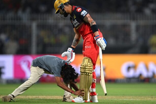 "18-Year-Old Fan Runs Onto Eden Gardens Field to Meet Virat Kohli, Gets Banned from IPL Season"